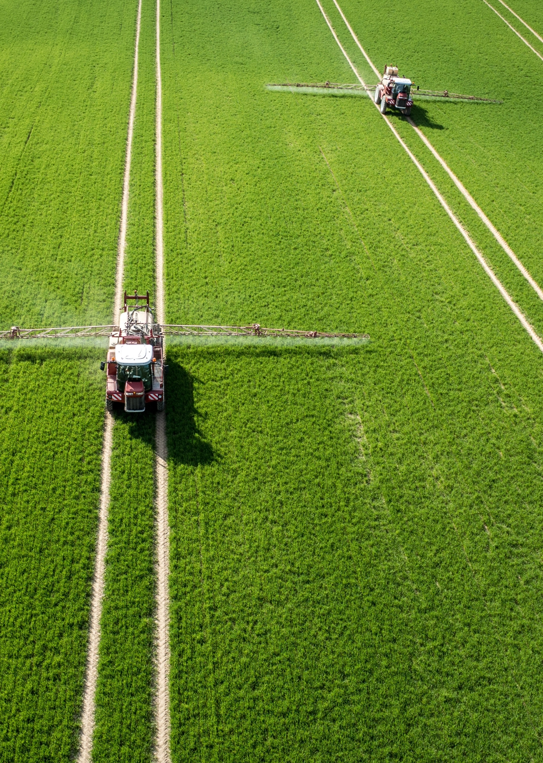 Tractors with Sprayers in Field